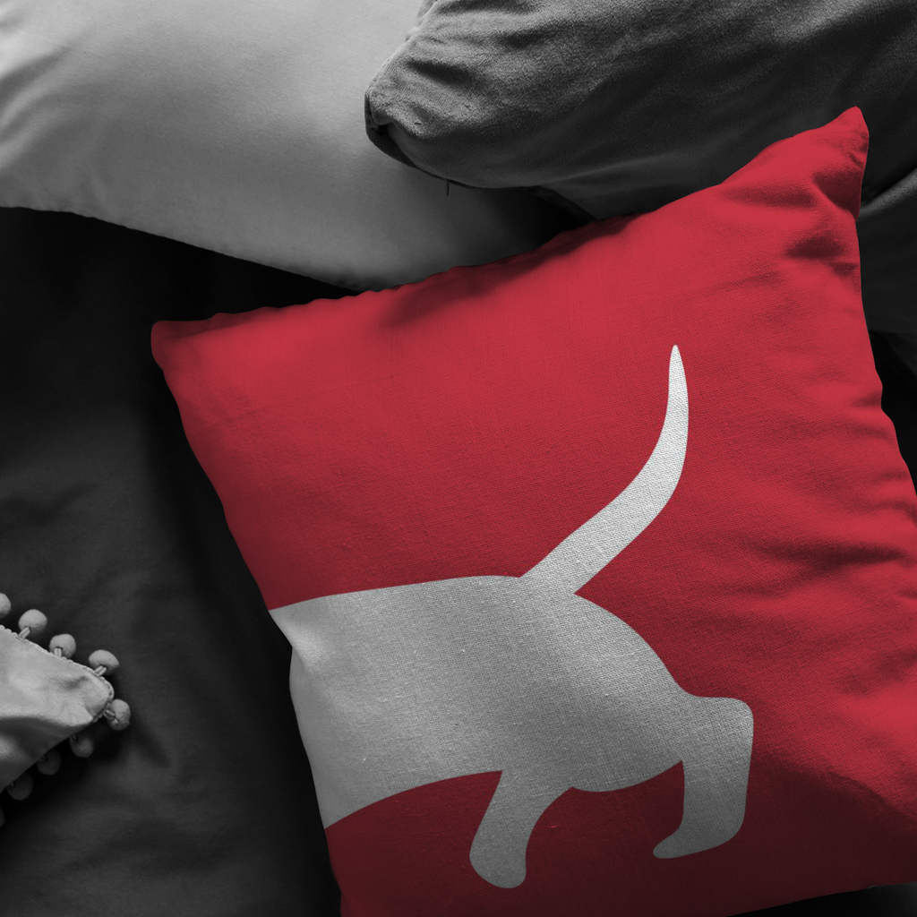 Red pillow with Dachshund silhouette in white